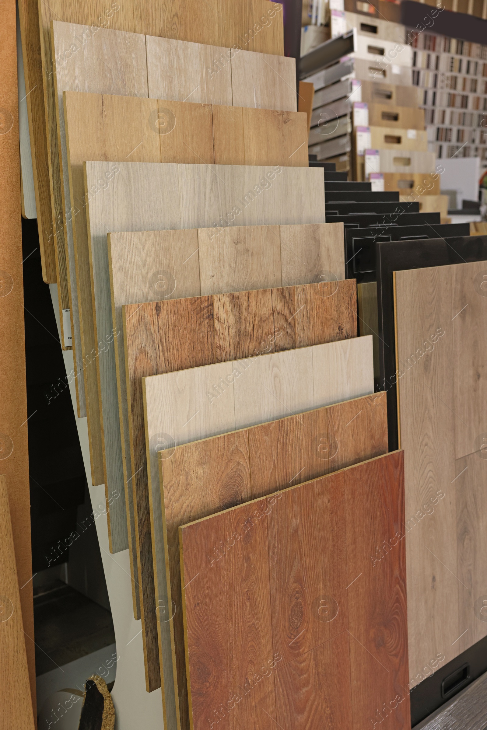 Photo of Many different samples of wooden flooring in store