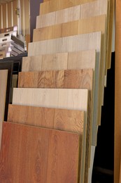 Photo of Many different samples of wooden flooring in store