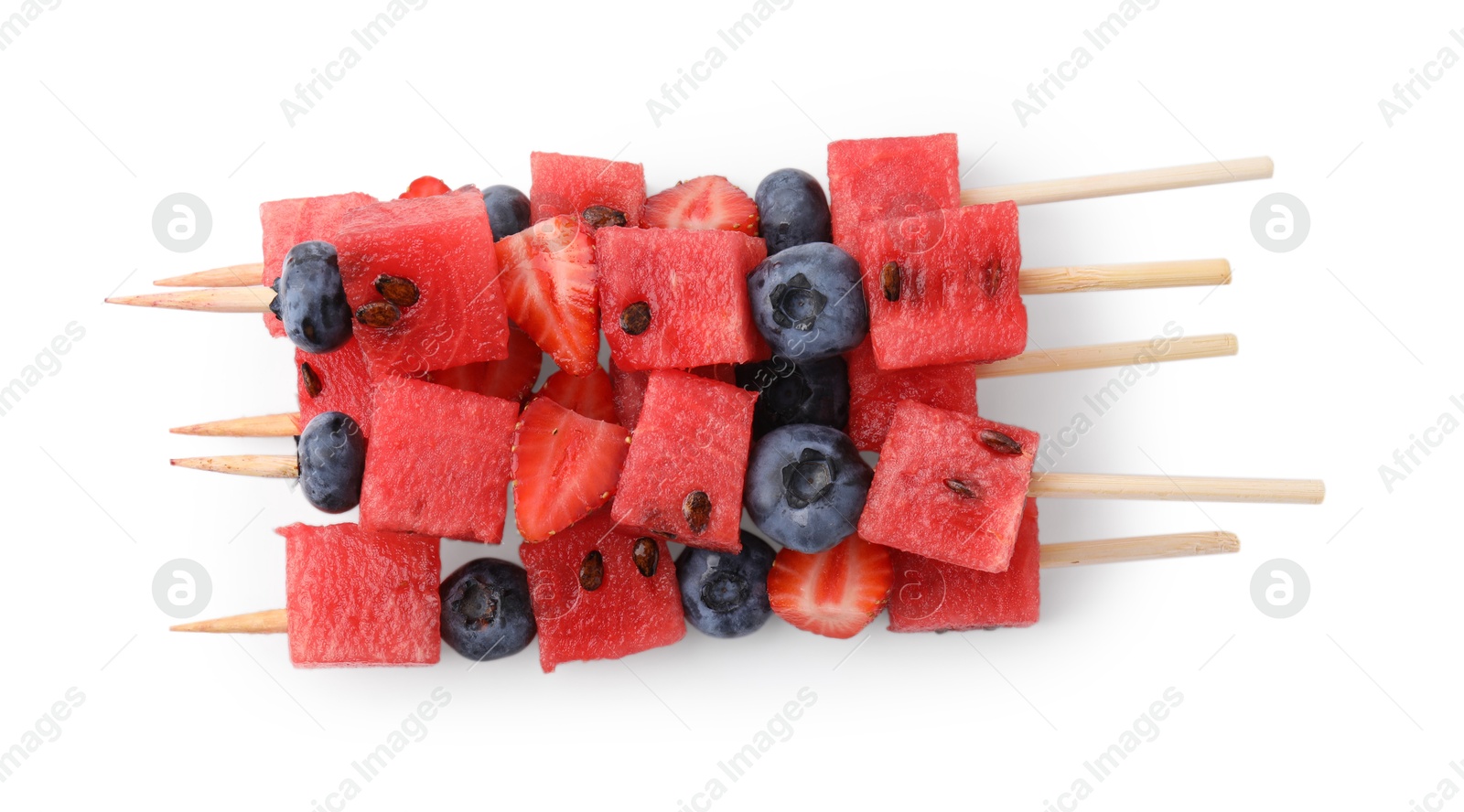 Photo of Skewers with tasty watermelon, blueberries and strawberries isolated on white, top view