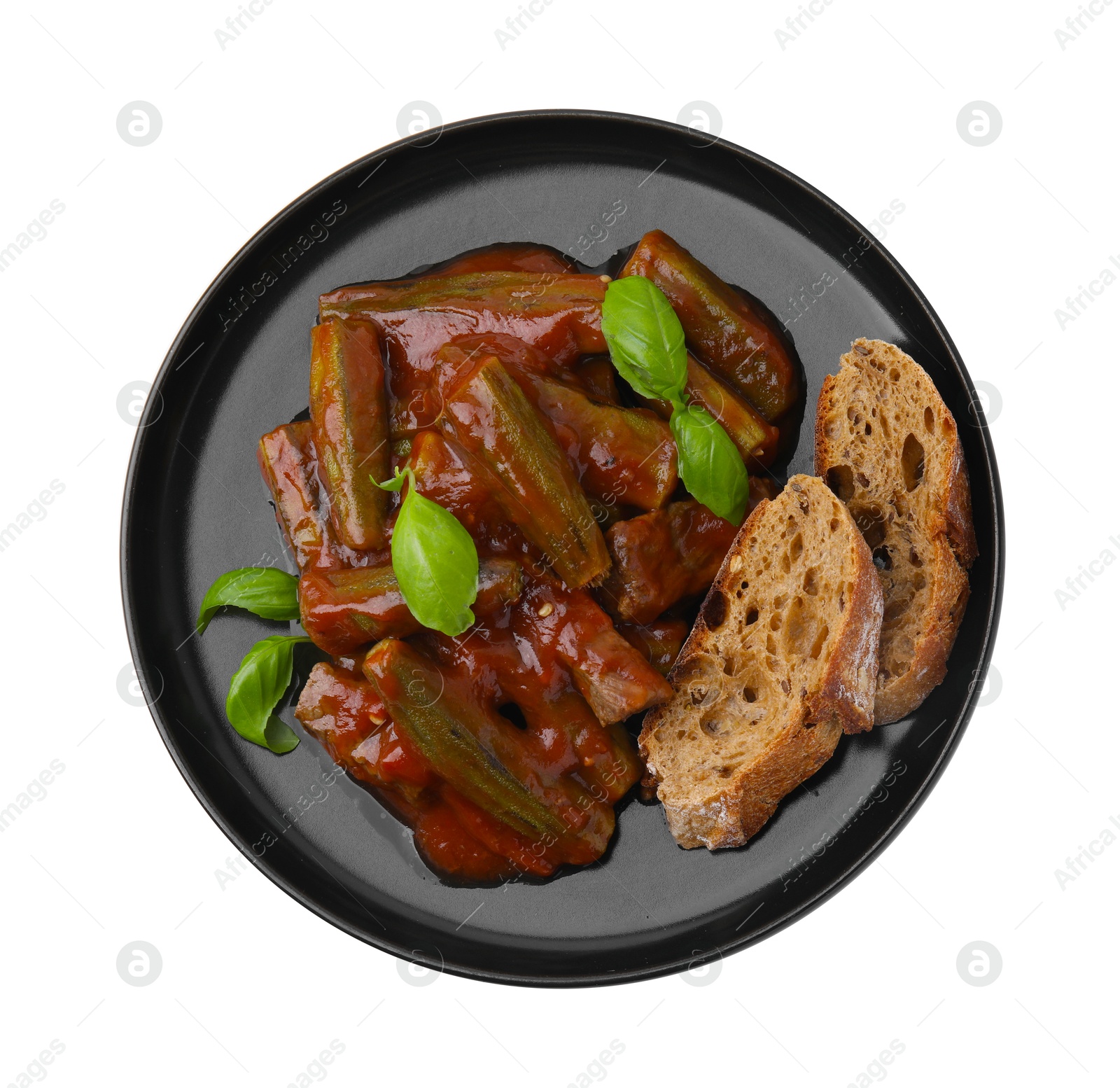 Photo of Tasty stew with okra, tomato sauce, bread and basil isolated on white, top view