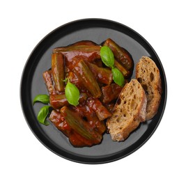 Tasty stew with okra, tomato sauce, bread and basil isolated on white, top view