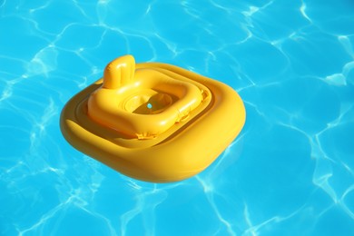 Photo of Yellow float in swimming pool at luxury resort