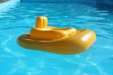 Yellow float in swimming pool at luxury resort