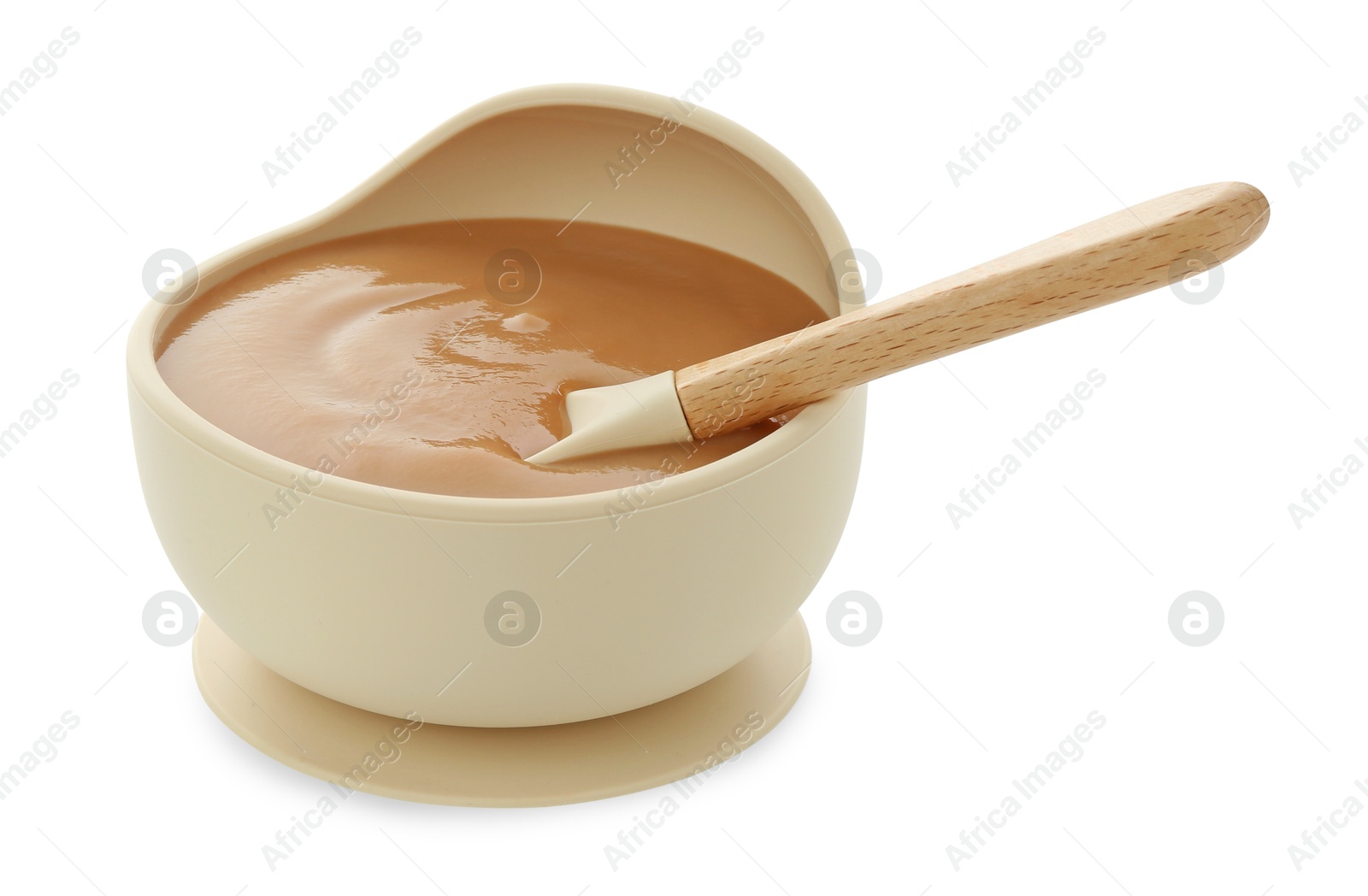 Photo of Tasty baby food and spoon in bowl isolated on white