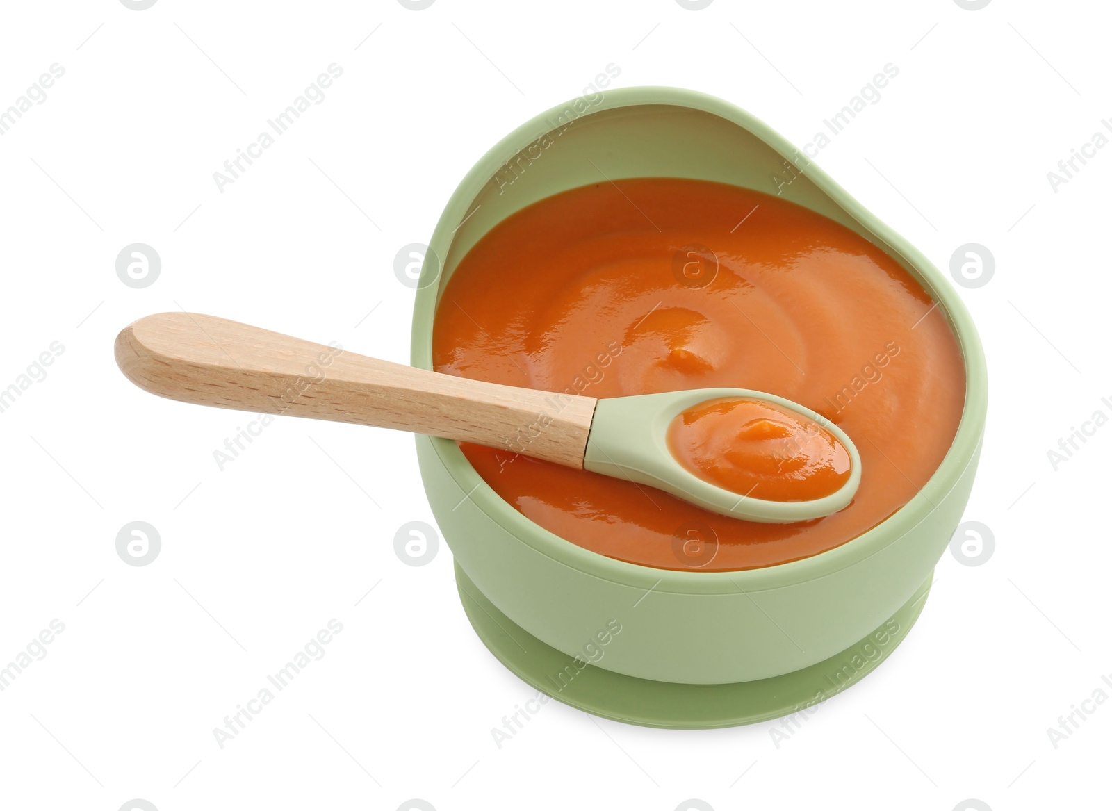 Photo of Tasty baby food in bowl and spoon isolated on white