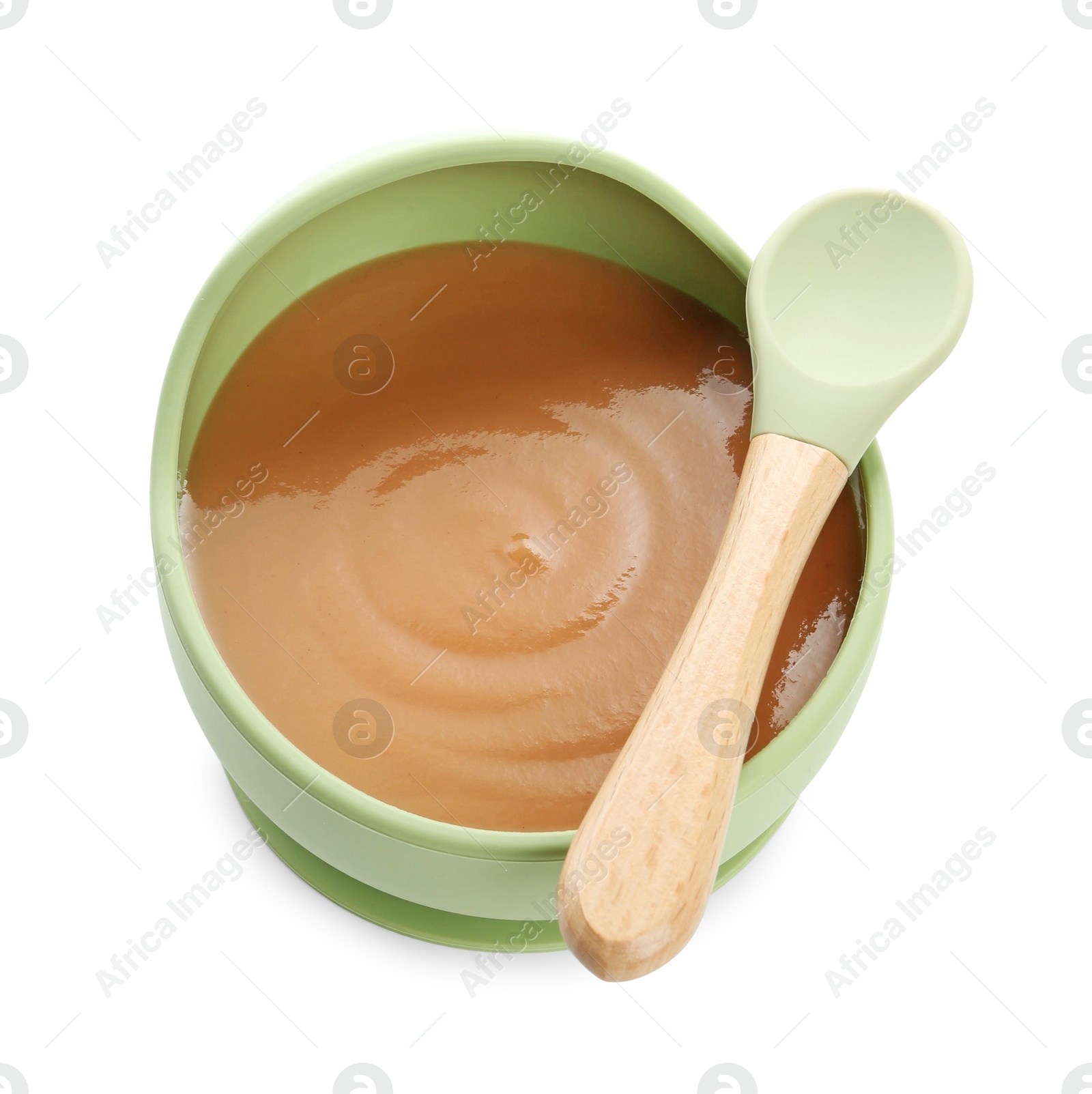 Photo of Delicious baby food in bowl and spoon isolated on white