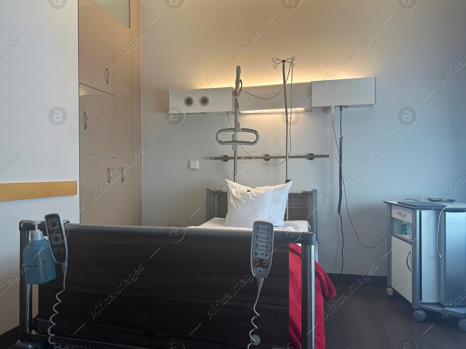 Photo of Modern interior of hospital ward with bed