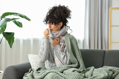 Cold symptom. Young woman with tissue at home