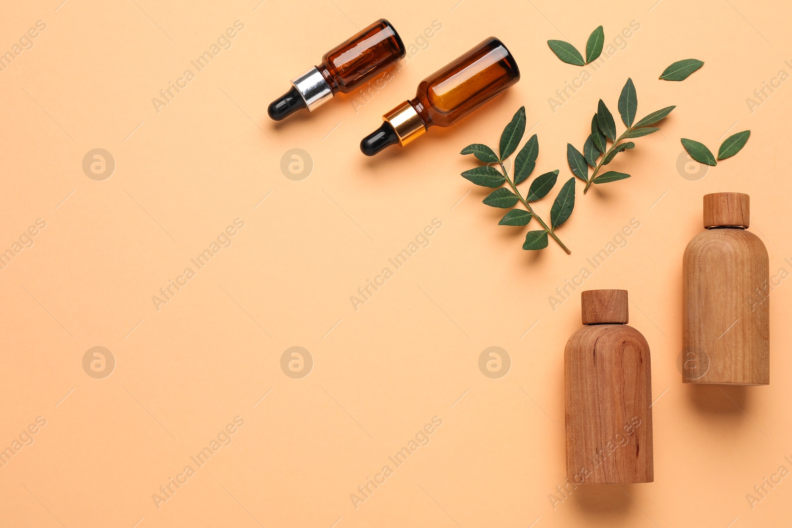 Photo of Different cosmetic products on pale orange background, flat lay. Space for text