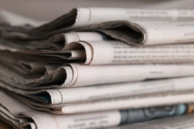 Many newspapers in different languages as background, closeup