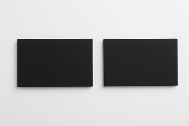 Photo of Blank business cards on light grey background, top view. Mockup for design