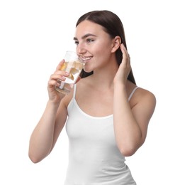 Photo of Woman drinking water with lemon on white background