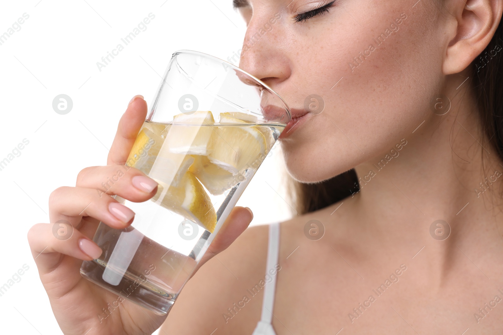 Photo of Woman drinking water with lemon on white background, closeup