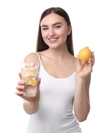 Photo of Woman with glass of lemon water and fruit on white background