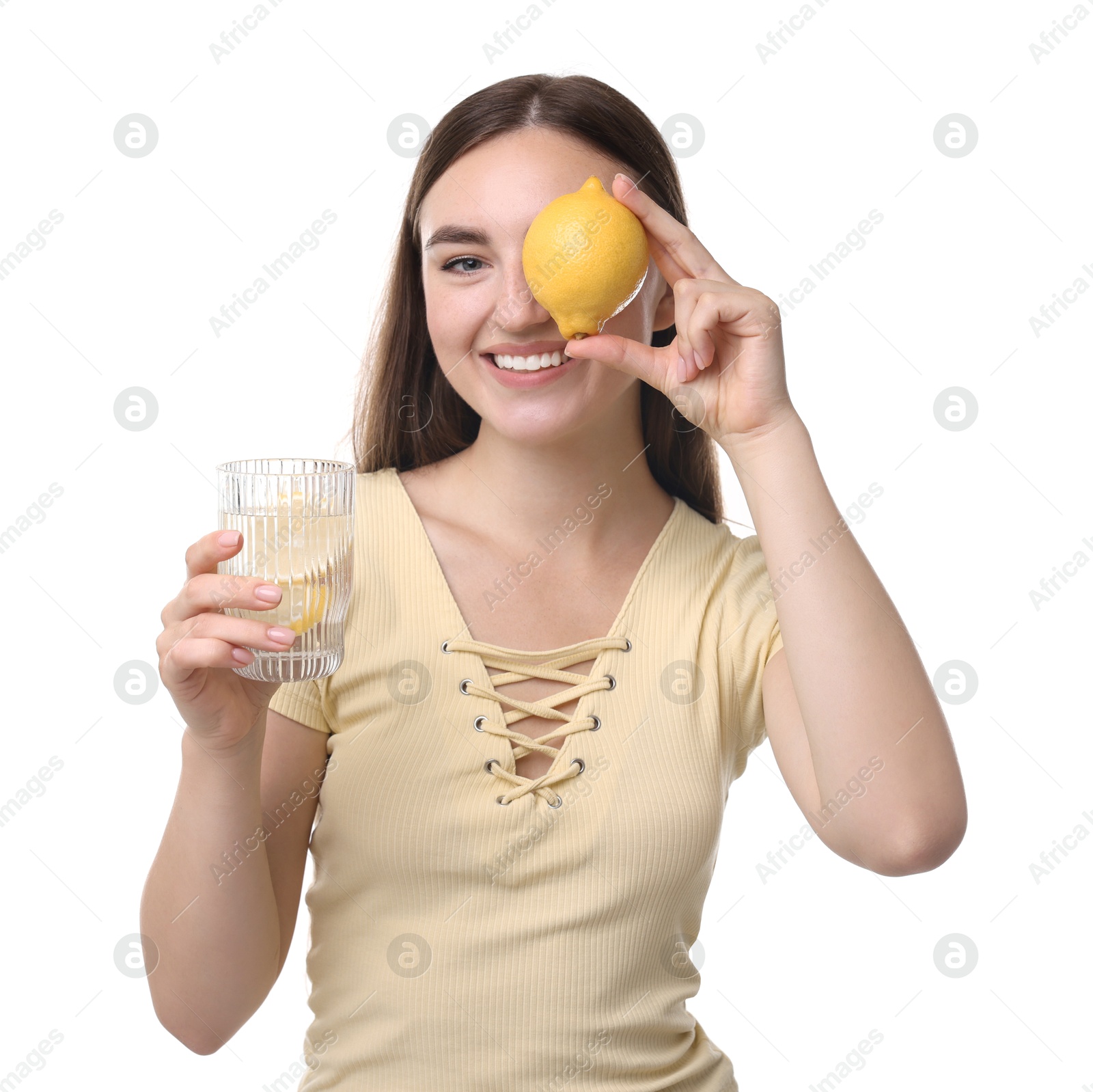 Photo of Woman with glass of lemon water and fruit on white background