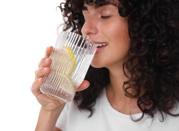 Photo of Woman drinking water with lemon on white background, closeup