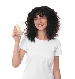 Woman with glass of lemon water on white background