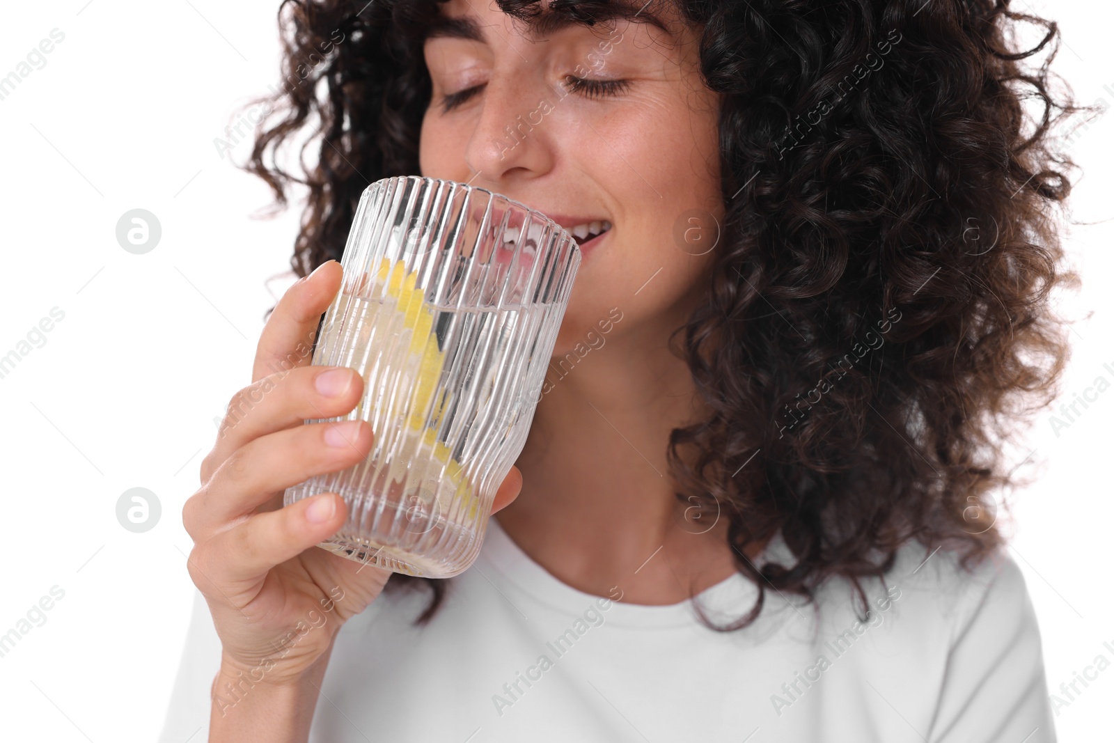 Photo of Woman drinking water with lemon on white background, closeup