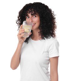 Woman drinking water with lemon on white background