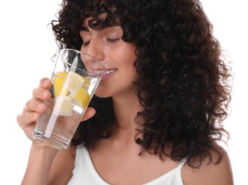 Woman drinking water with lemon on white background