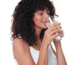 Woman drinking water with lemon on white background