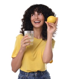 Woman with glass of lemon water and fruit on white background