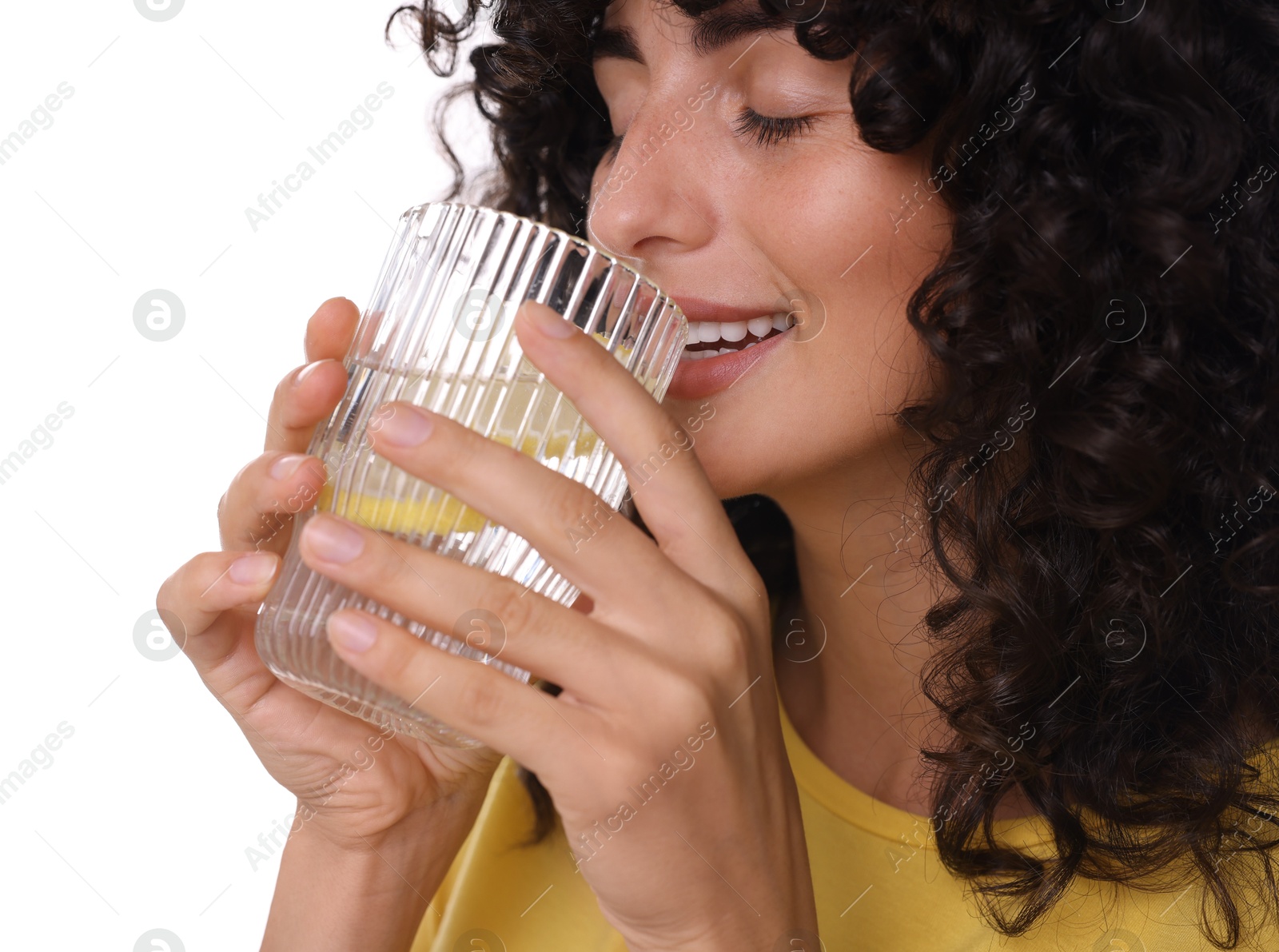 Photo of Woman drinking water with lemon on white background, closeup