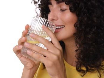 Woman drinking water with lemon on white background, closeup