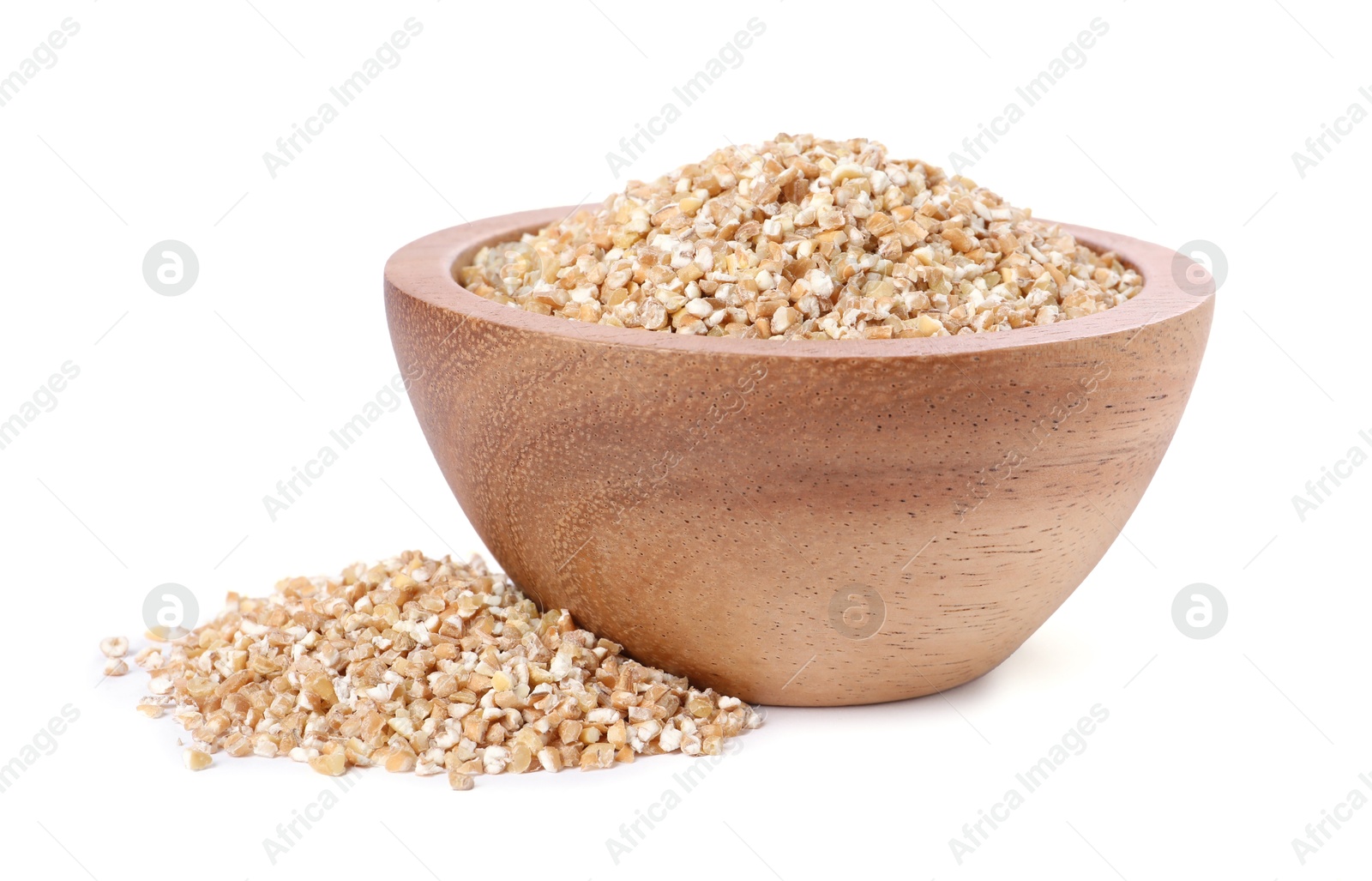 Photo of Dry wheat groats in wooden bowl isolated on white