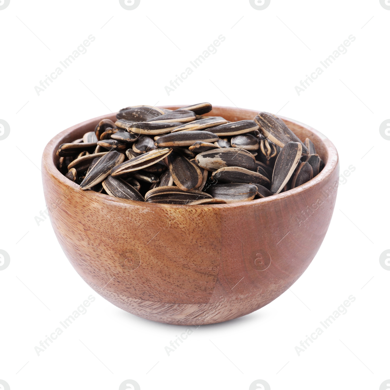 Photo of Sunflower seeds in wooden bowl isolated on white