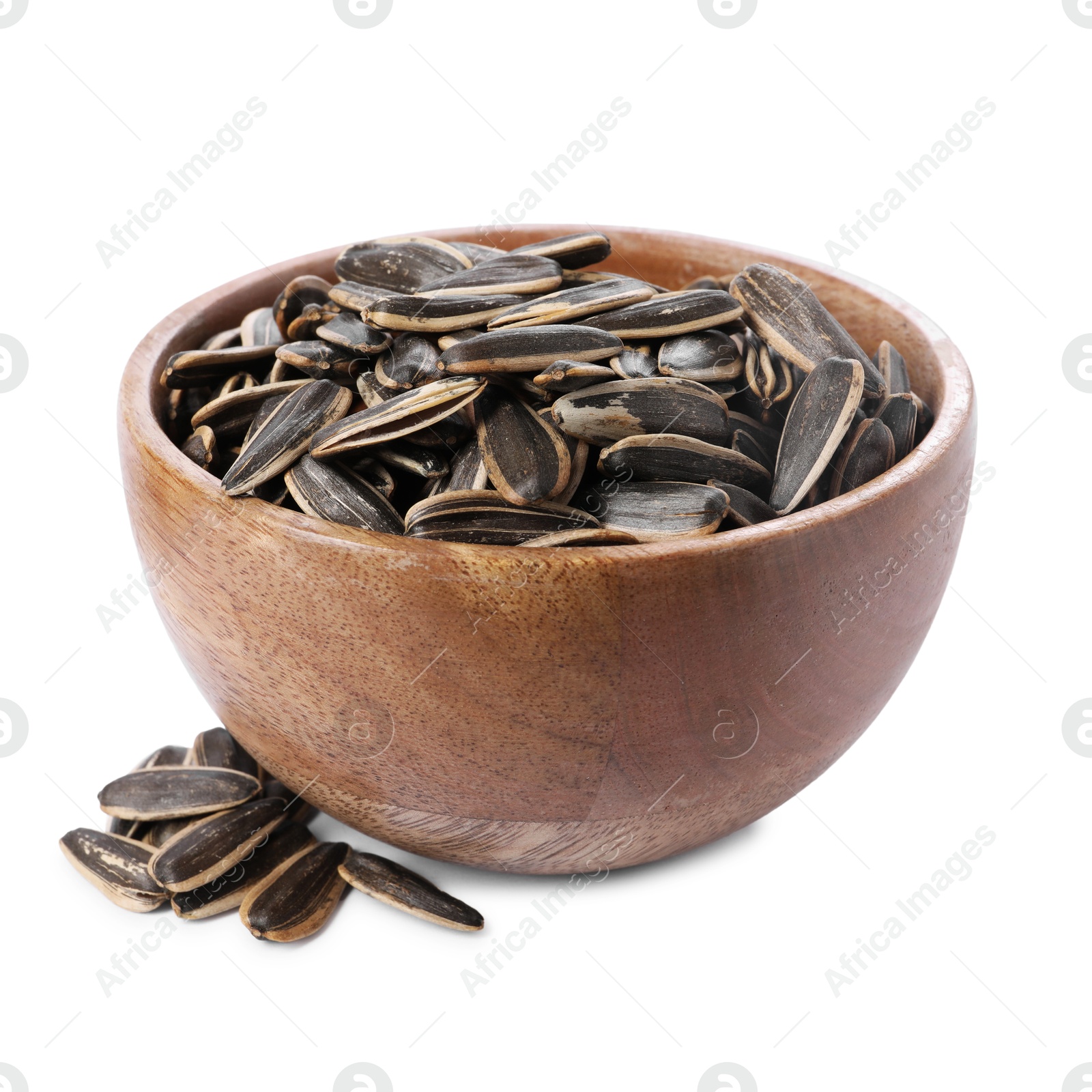 Photo of Sunflower seeds in wooden bowl isolated on white