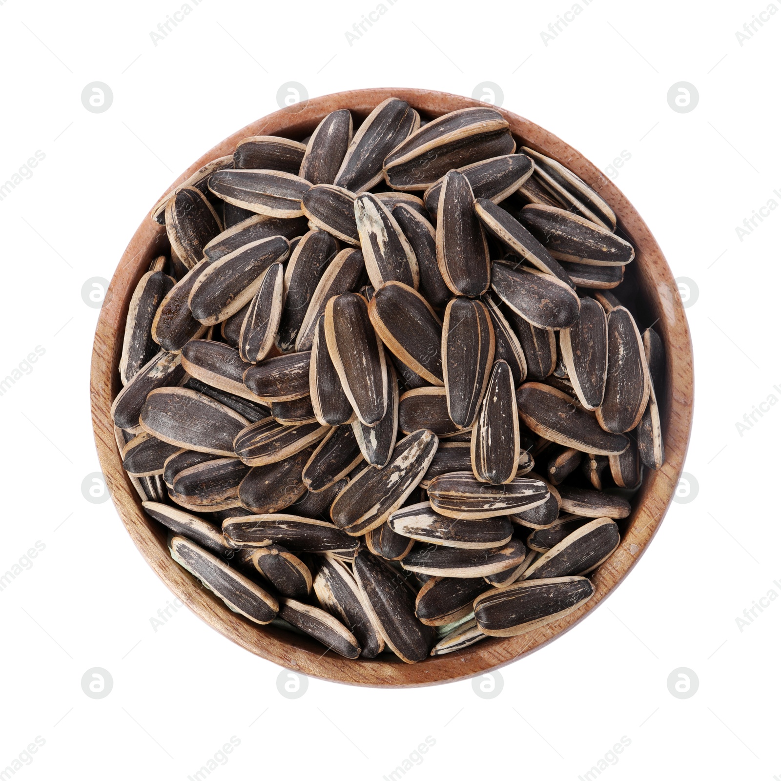 Photo of Sunflower seeds in wooden bowl isolated on white, top view