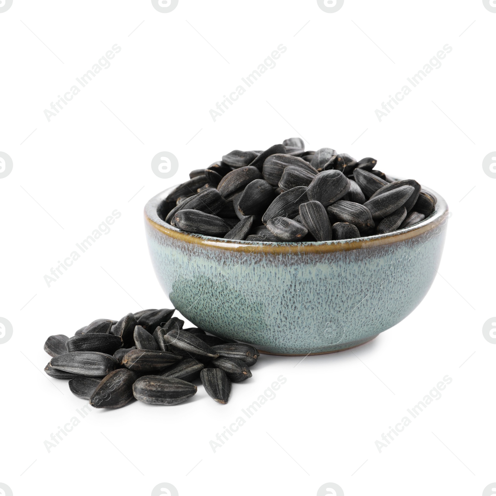 Photo of Sunflower seeds in bowl isolated on white