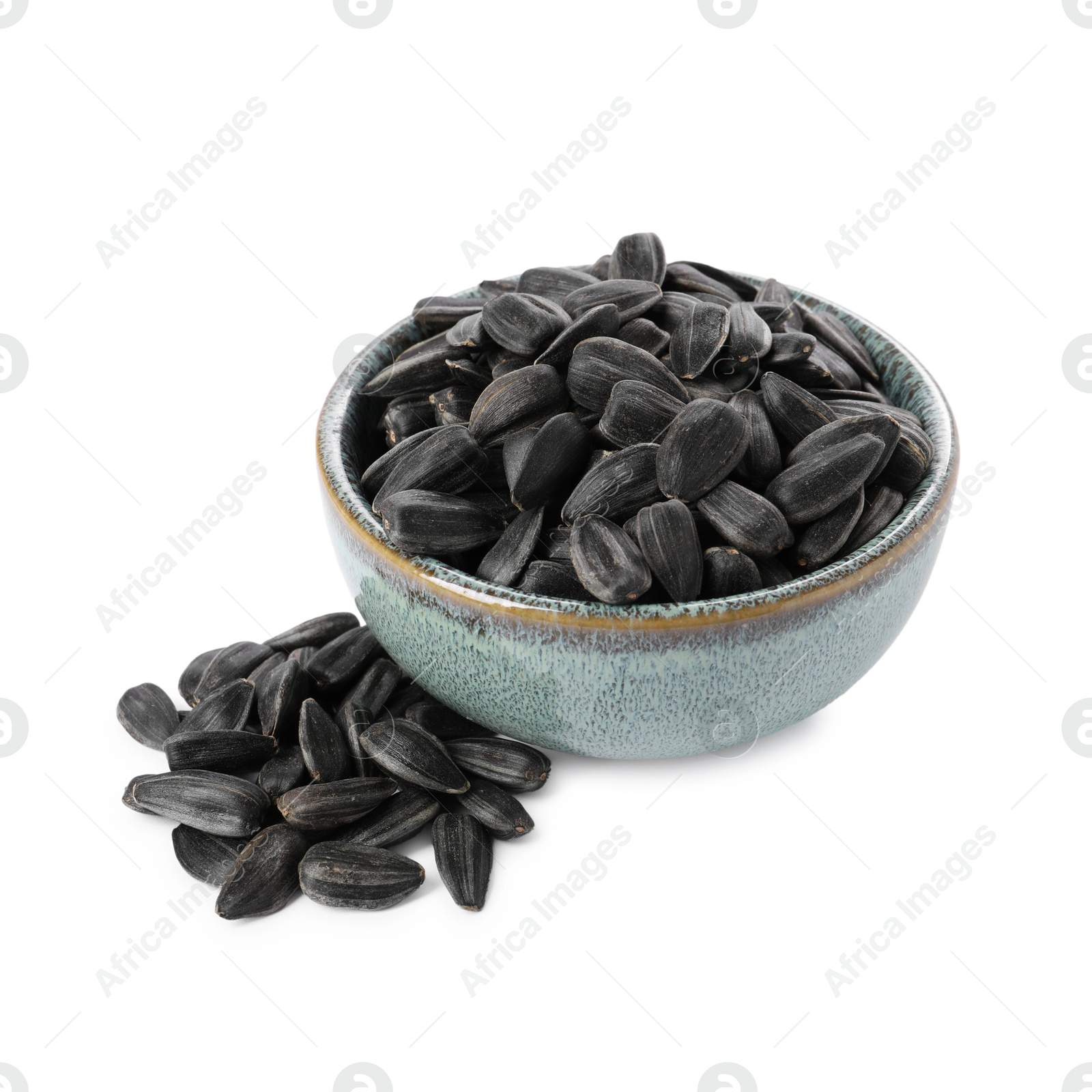 Photo of Sunflower seeds in bowl isolated on white