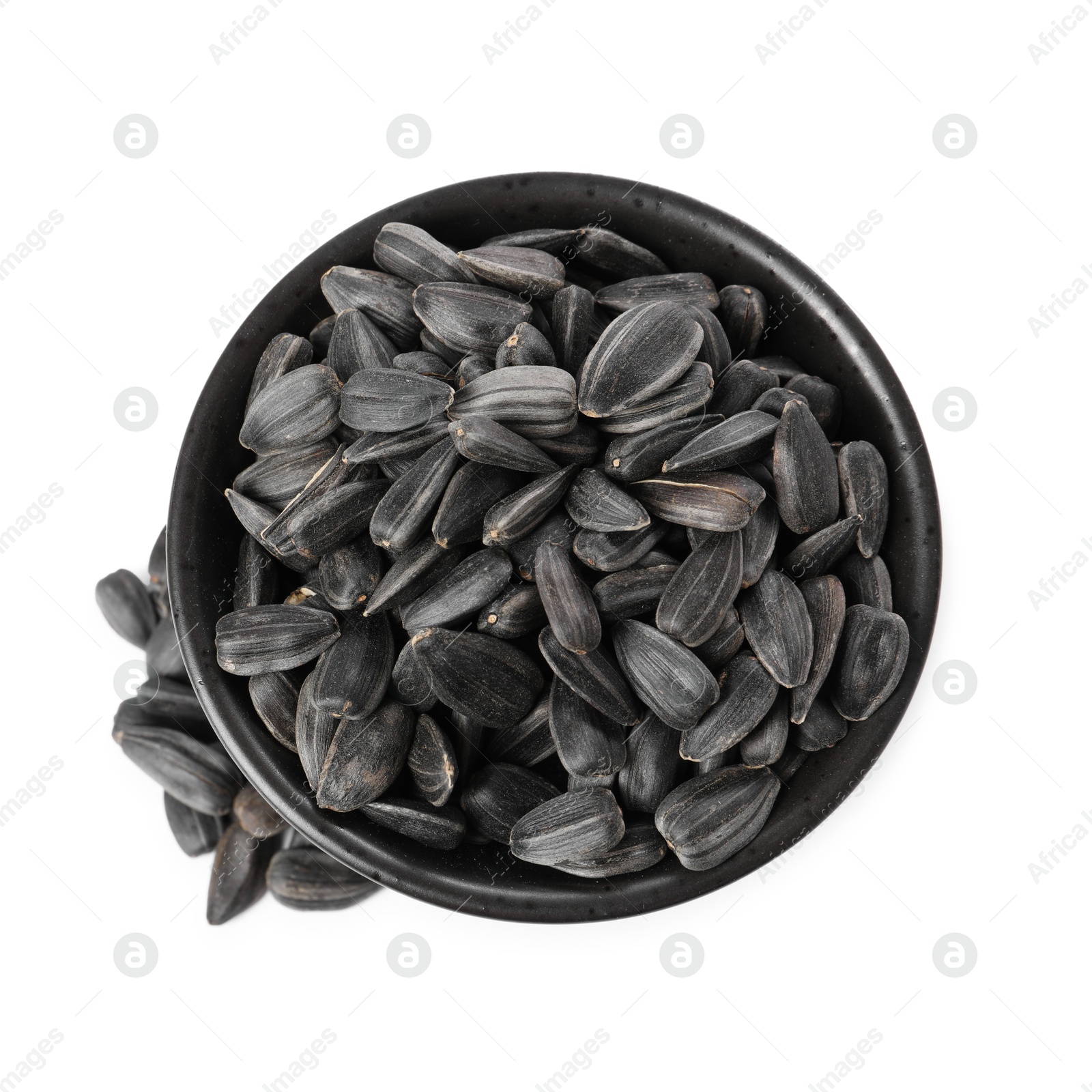 Photo of Sunflower seeds in bowl isolated on white, top view