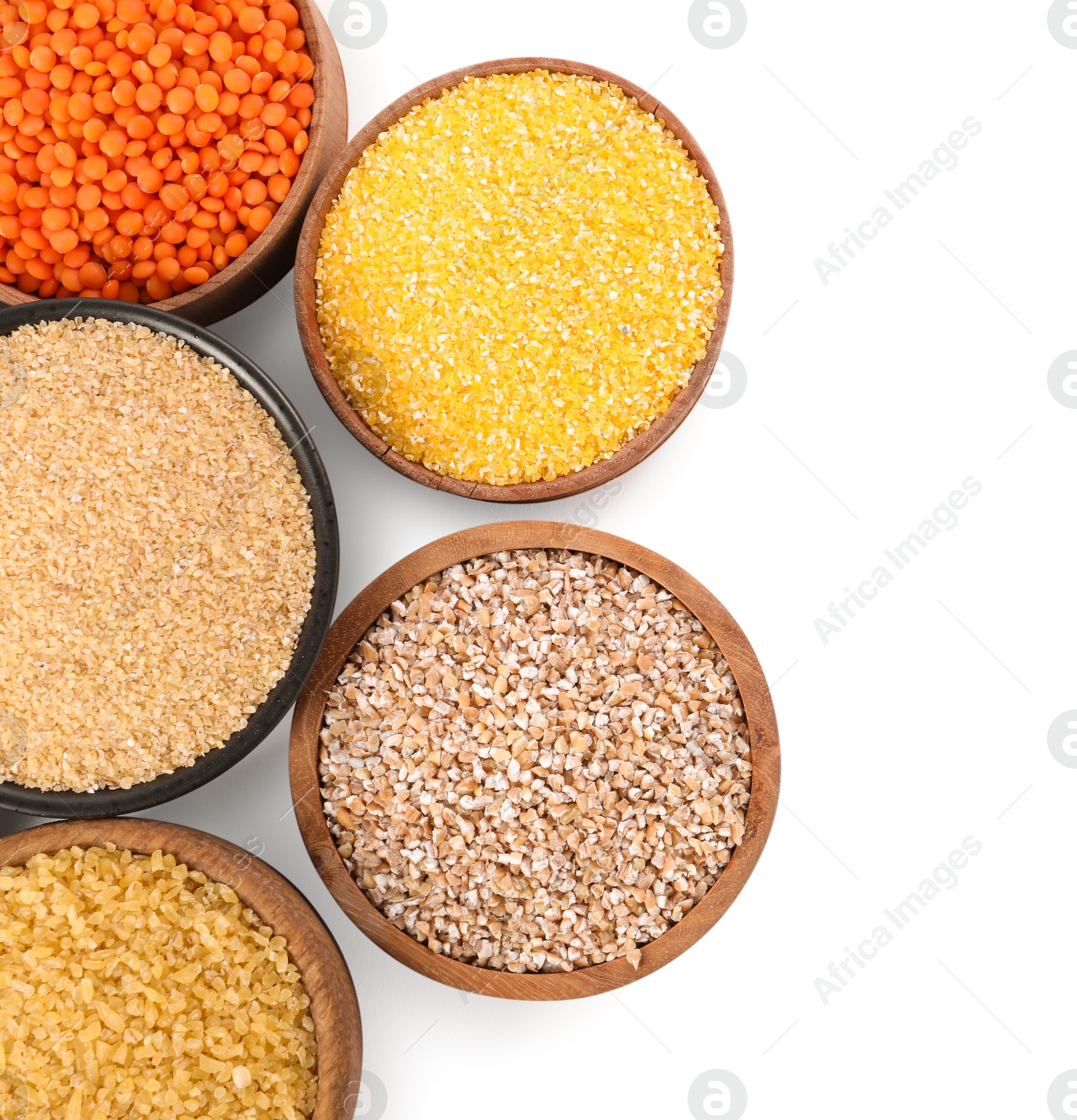 Photo of Different types of cereals isolated on white, top view