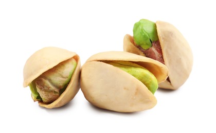 Photo of Three tasty pistachio nuts isolated on white