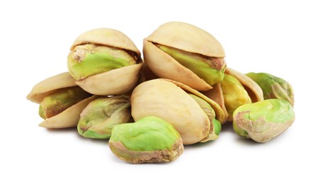 Photo of Heap of tasty pistachio nuts isolated on white