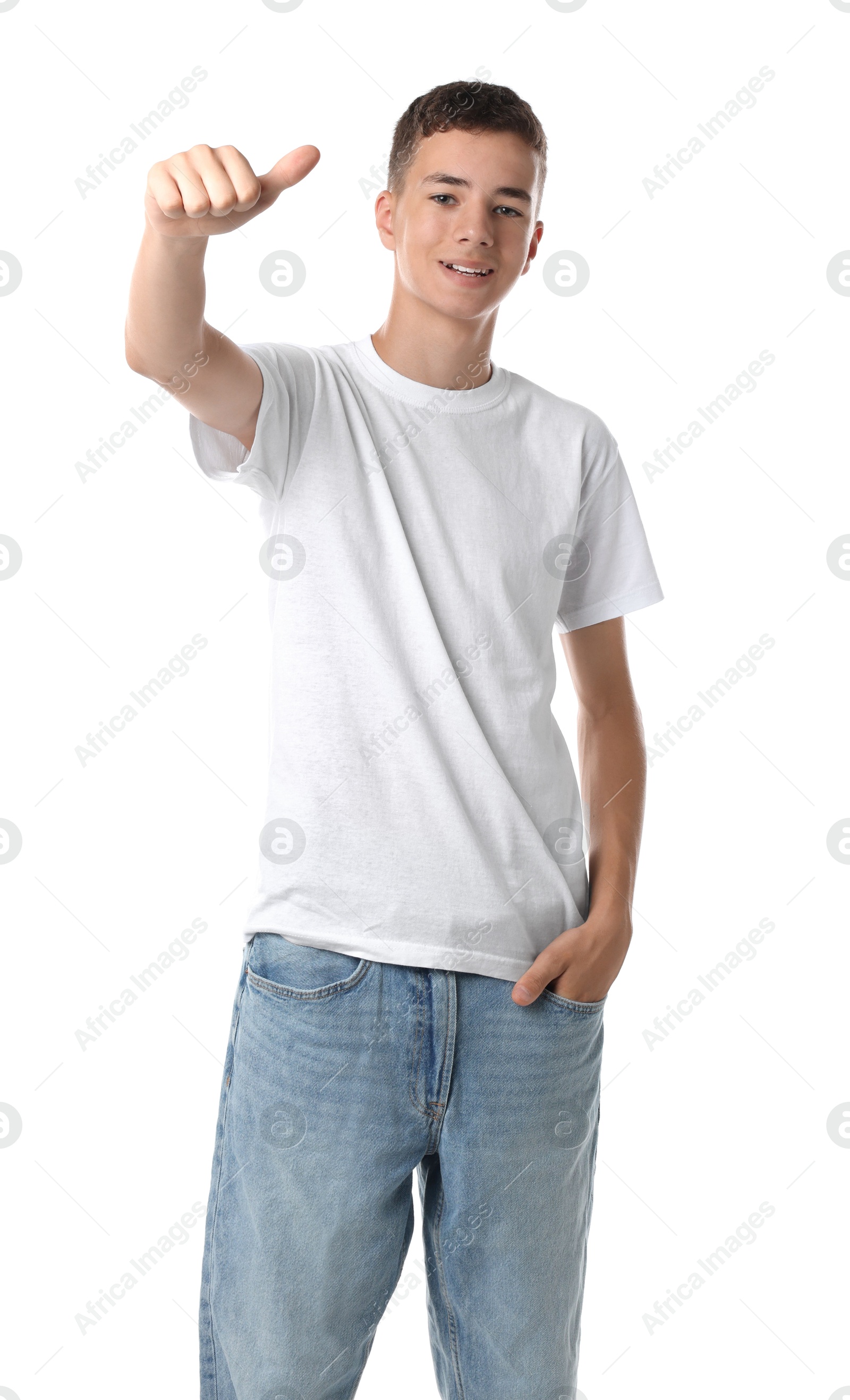 Photo of Teenage boy wearing t-shirt and showing thumbs up on white background