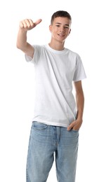 Teenage boy wearing t-shirt and showing thumbs up on white background