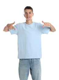 Teenage boy wearing light blue t-shirt on white background