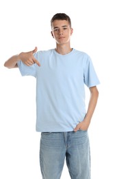 Teenage boy wearing light blue t-shirt on white background