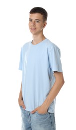 Teenage boy wearing light blue t-shirt on white background