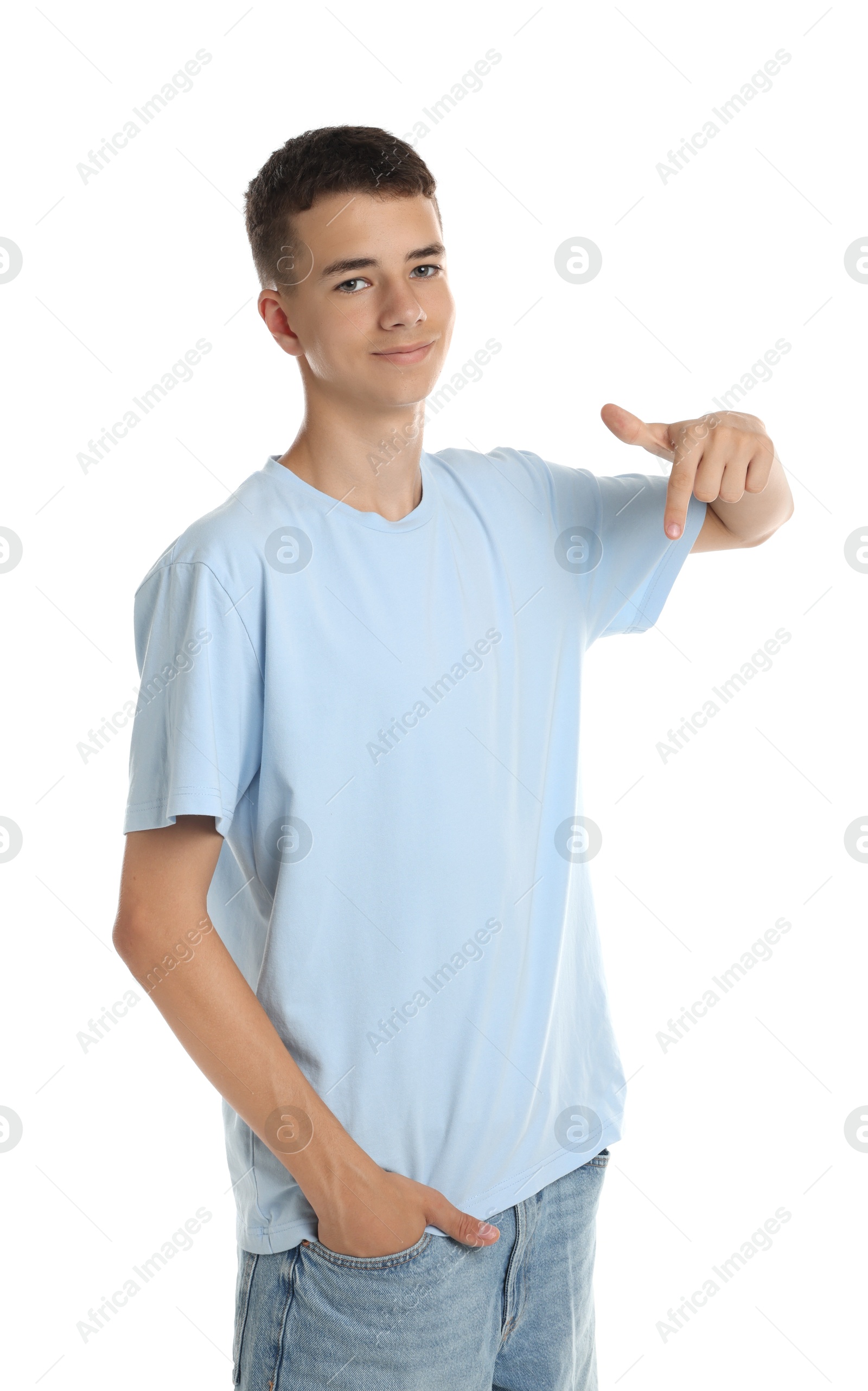 Photo of Teenage boy wearing light blue t-shirt on white background