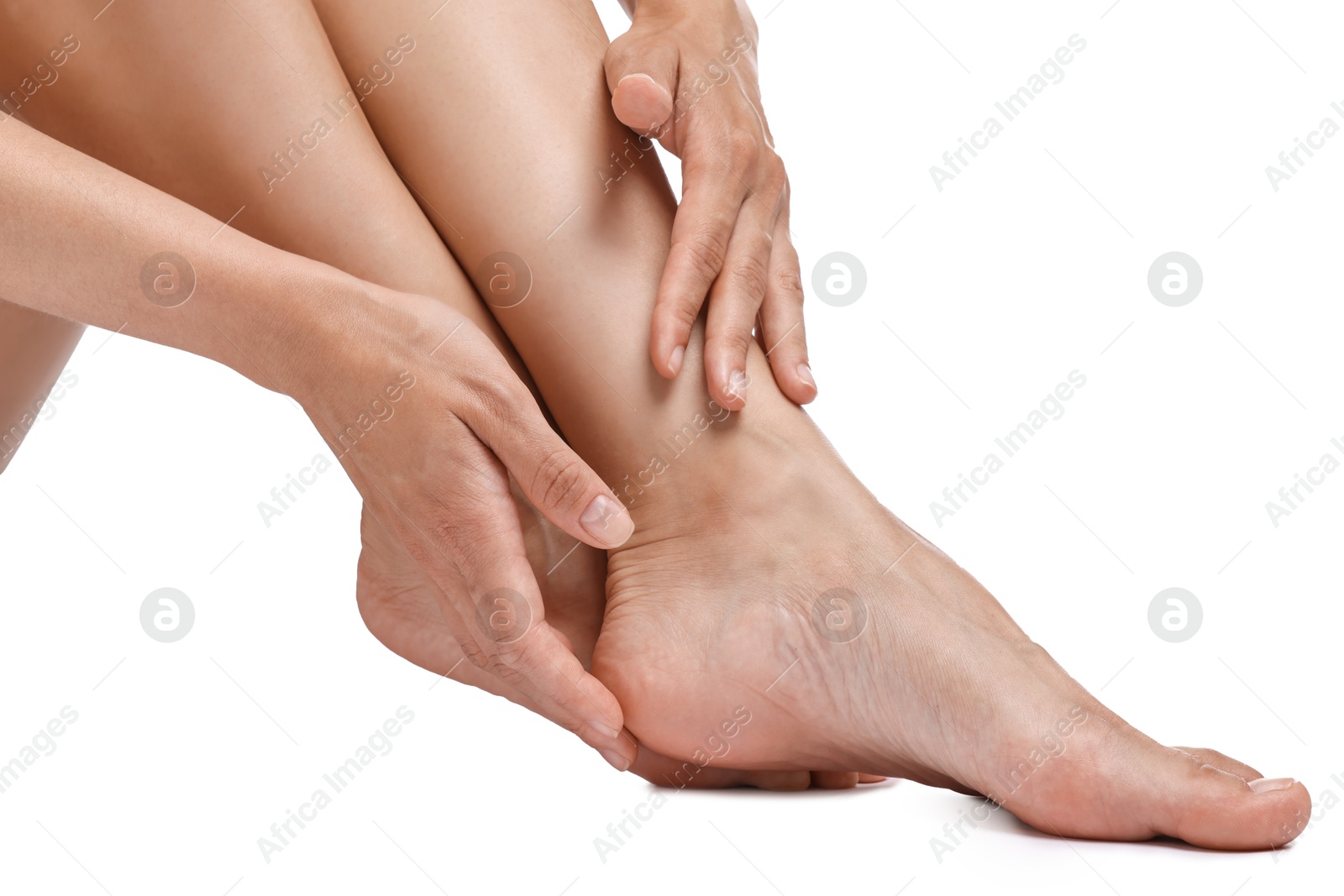 Photo of Woman touching her smooth feet on white background, closeup