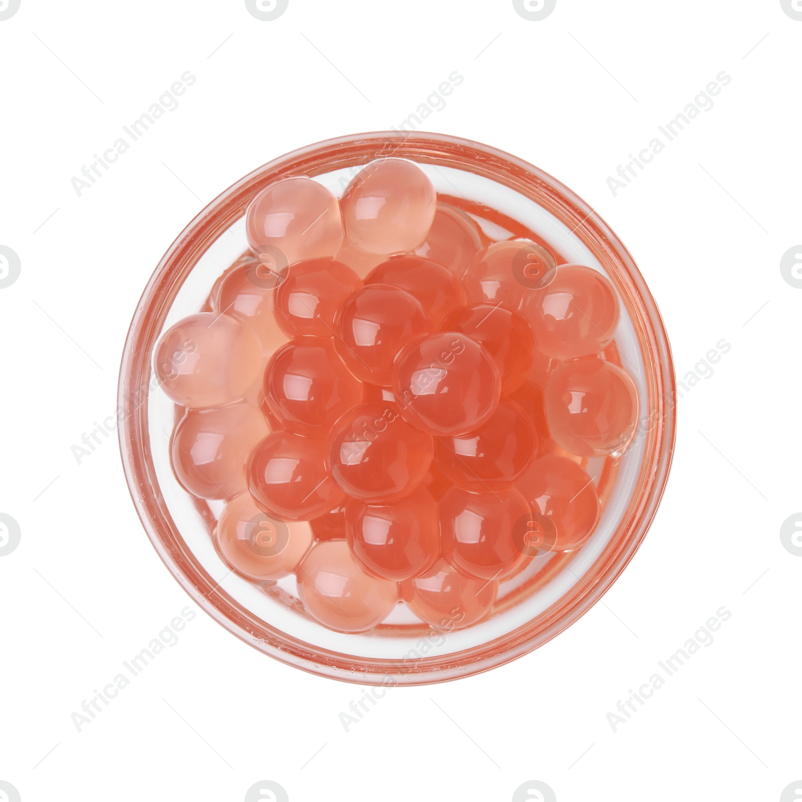 Photo of Bright tapioca pearls in bowl isolated on white, top view