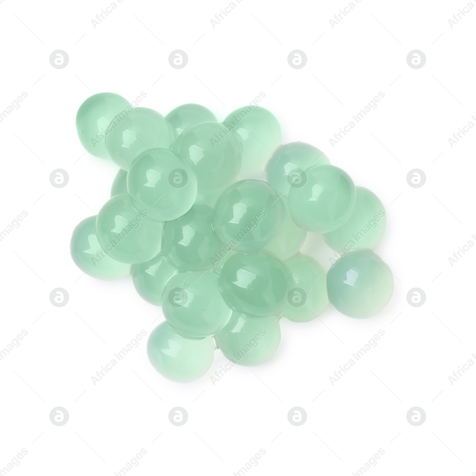 Photo of Pile of bright tapioca pearls isolated on white, top view