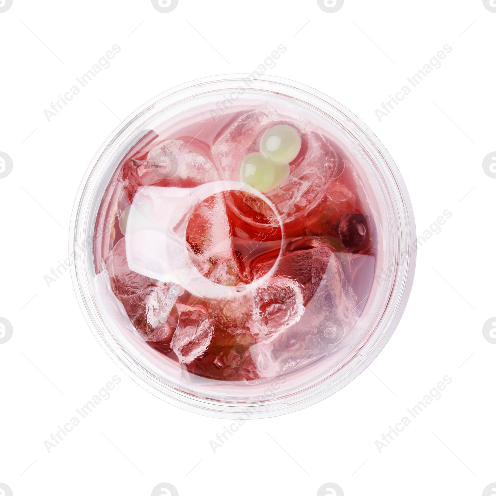 Photo of Tasty bubble tea in plastic cup on white background, top view