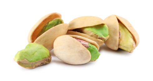 Photo of Many tasty pistachio nuts isolated on white