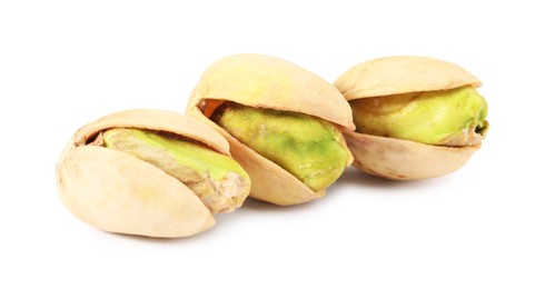 Three tasty pistachio nuts isolated on white